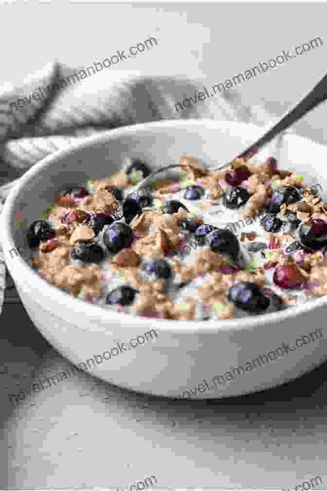 A Bowl Of Oatmeal Topped With Fresh Berries And Chopped Nuts. Breakfast Cookbook For Beginners: Easy Delicious Breakfast Ideas Breakfast Recipes