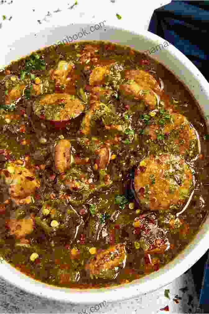 A Steaming Bowl Of Classic Cajun Gumbo, With Its Rich, Flavorful Broth, Succulent Shrimp, And Tender Okra. Louisiana Cooking: Easy Cajun And Creole Recipes From Louisiana