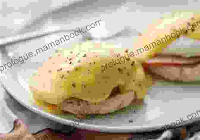 Classic Eggs Benedict Served On A Bed Of Wilted Spinach, Topped With A Creamy Hollandaise Sauce The Easy Puerto Rican Cookbook: 100 Classic Recipes Made Simple