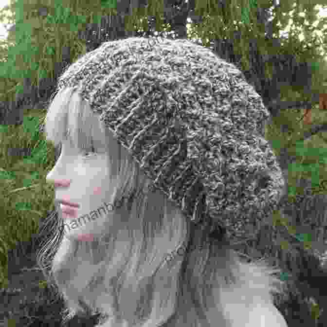 Crocheted Josie Slouchy Beanie Hat In A Soft Gray Color, Folded Up On A Wooden Surface Josie Slouchy Beanie Hat Crochet Pattern